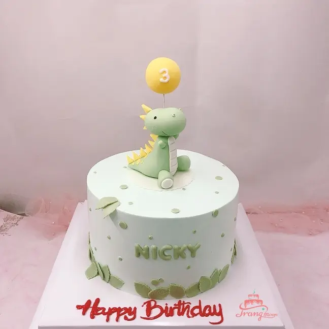 Bánh fondant hình chú khủng long màu xanh đang ngồi trên bãi cỏ xanh biếc -  Bánh Thiên Thần : Chuyên nhận đặt bánh sinh nhật theo mẫu